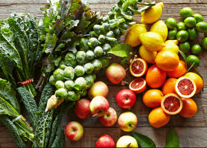 a group of fruits and vegetables on a wood surface Healthy Weight Loss Diets Stoke on Trent
